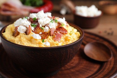 Photo of Delicious traditional banosh in bowl, closeup view