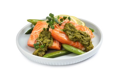 Photo of Tasty cooked salmon with pesto sauce on white background