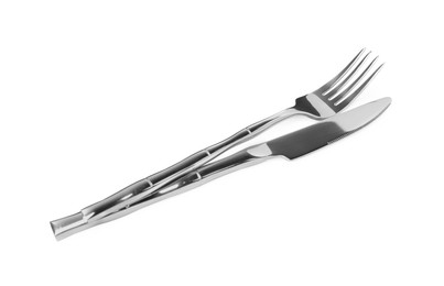 Photo of Fork and knife isolated on white. Stylish shiny cutlery set