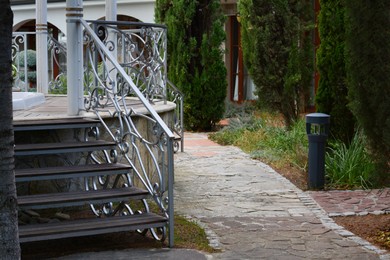 Photo of View of outdoor stairs with metal railing in park