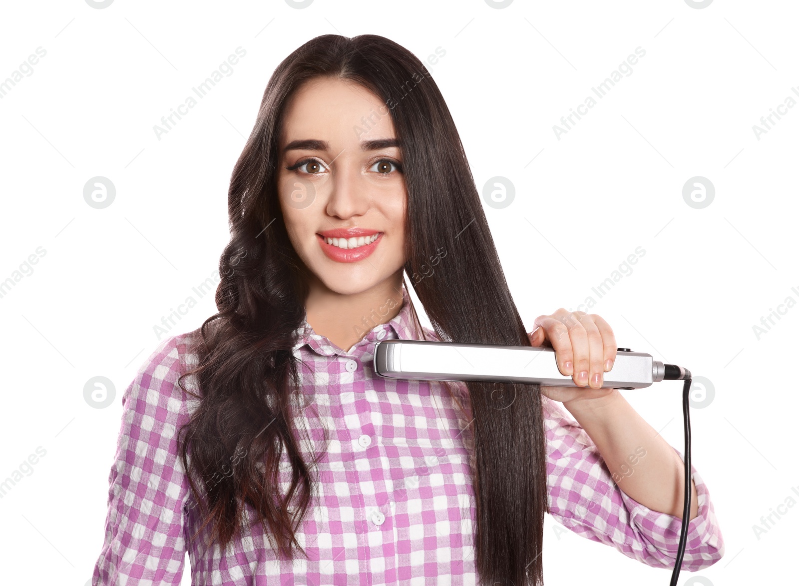 Photo of Happy woman using hair iron on white background