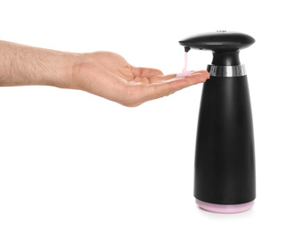Photo of Man using automatic soap dispenser on white background, closeup