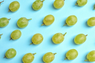 Photo of Fresh ripe juicy green grapes on color background, top view