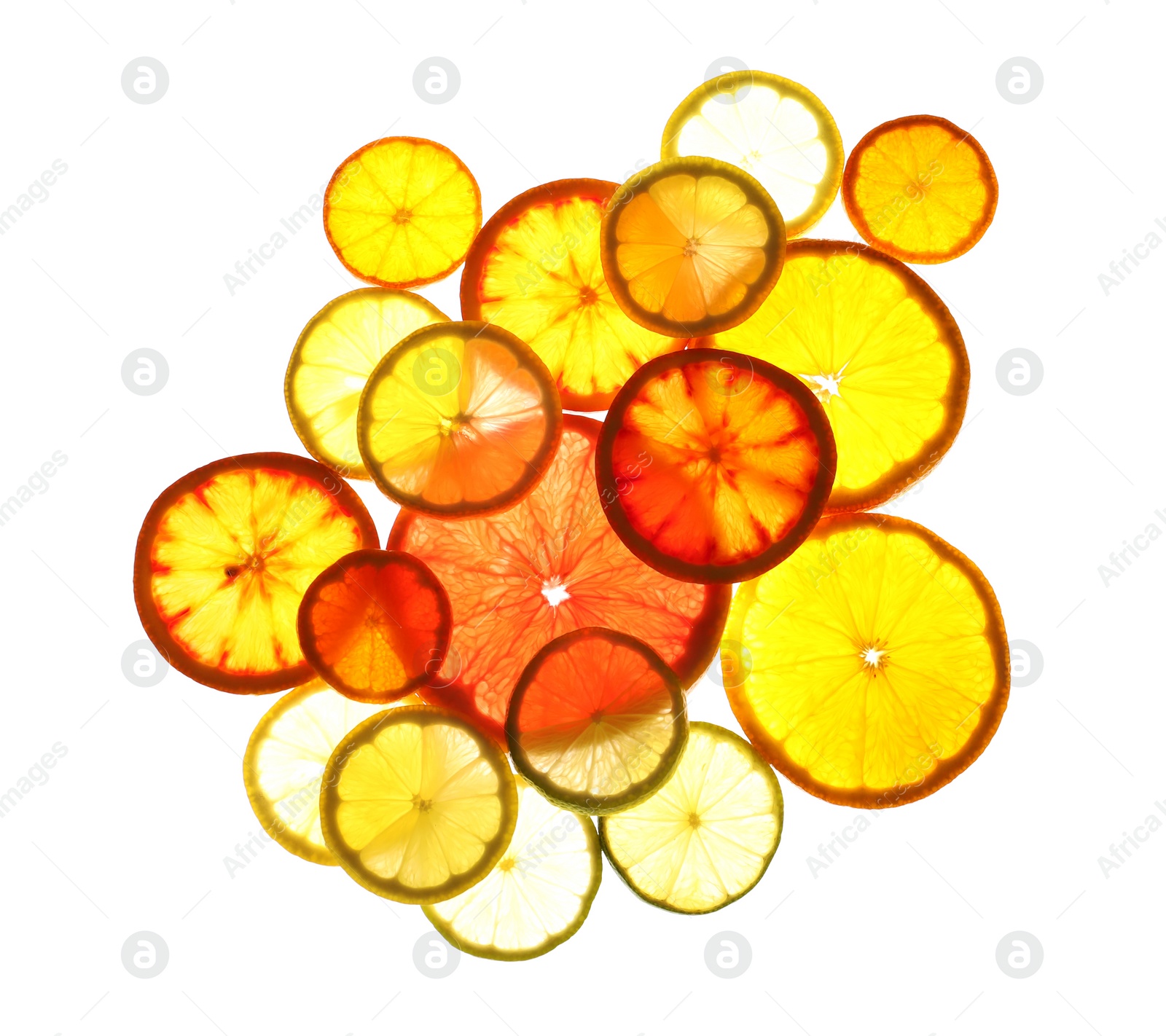 Photo of Illuminated slices of citrus fruits on white background, top view