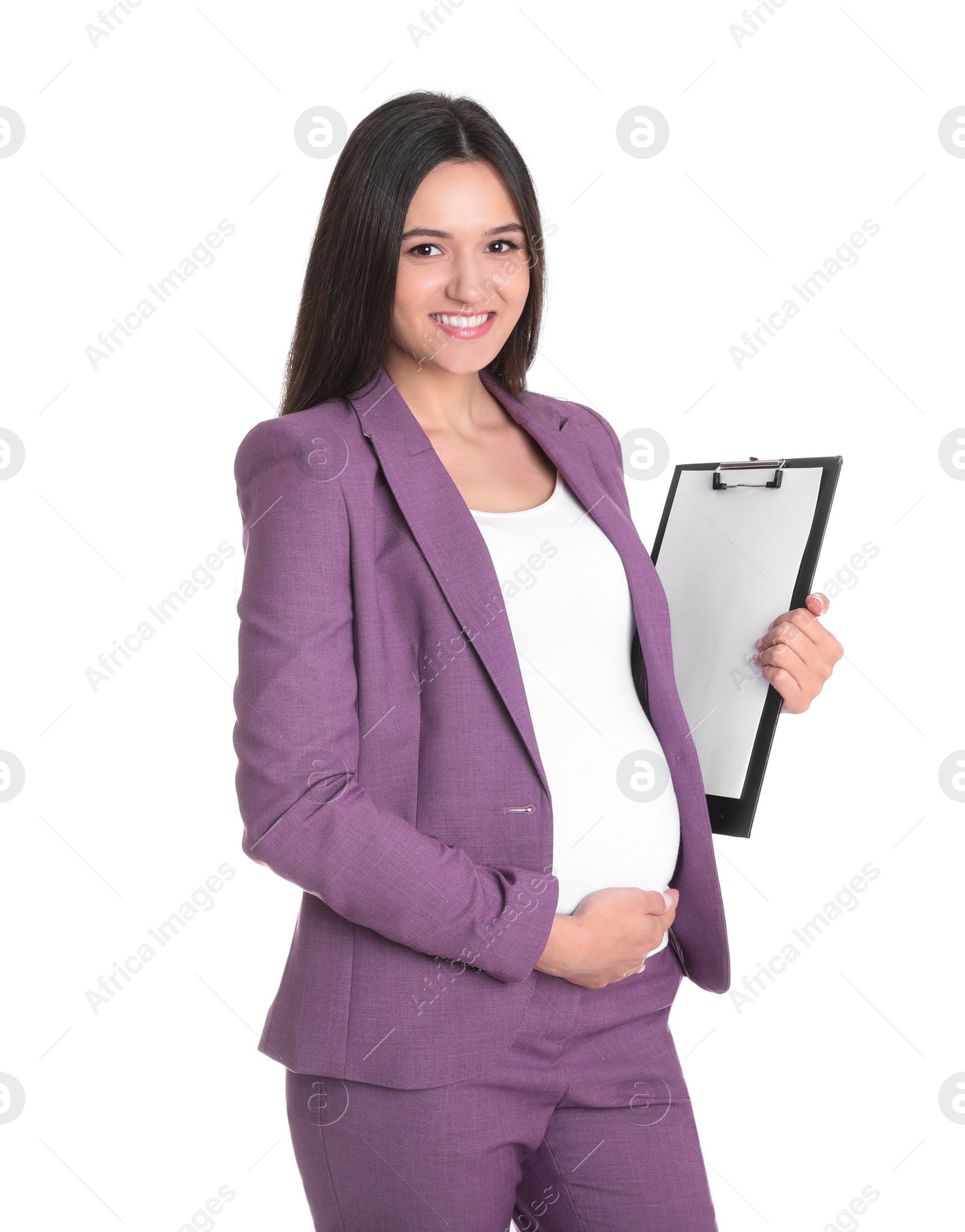 Photo of Young pregnant woman in suit with clipboard on white background. Working while expecting baby