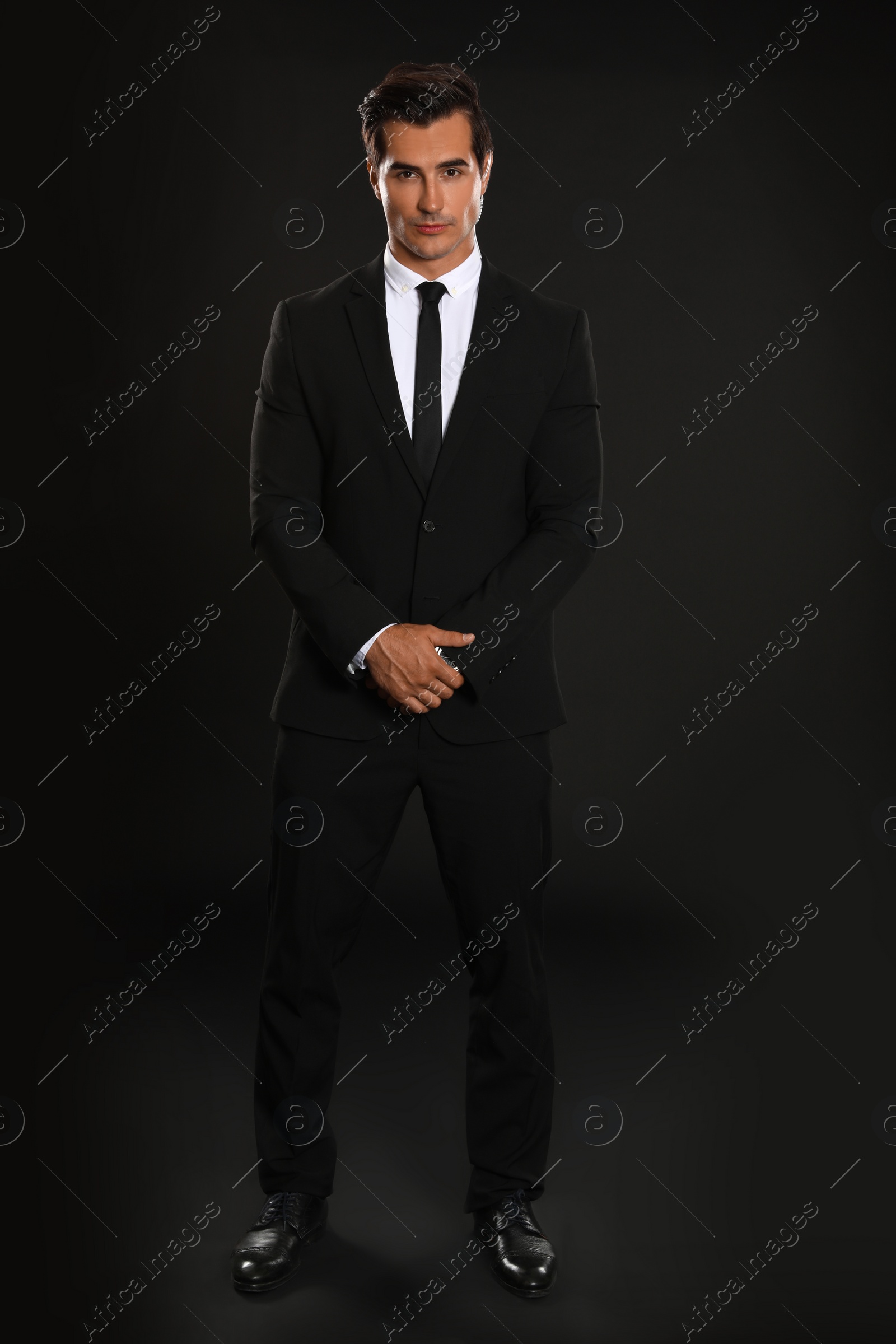 Photo of Male security guard in uniform on dark background