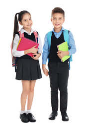 Photo of Little children with school stationery on white background