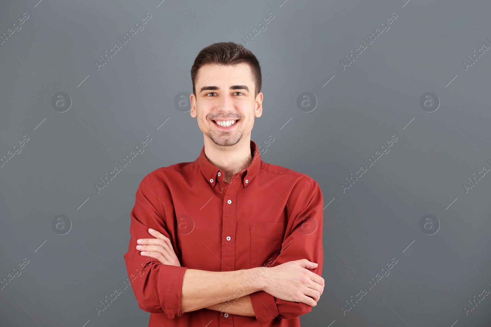 Photo of Charming young man on grey background