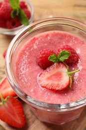 Delicious berry mousse with mint in glass dish, closeup