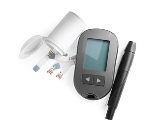 Photo of Glucometer, lancet pen and bottle with strips on white background, top view. Diabetes testing kit
