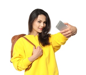 Attractive young woman taking selfie on white background