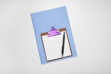 Photo of To do notes, planner and pen on white background, top view