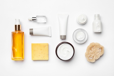 Photo of Flat lay composition with body care products on white background