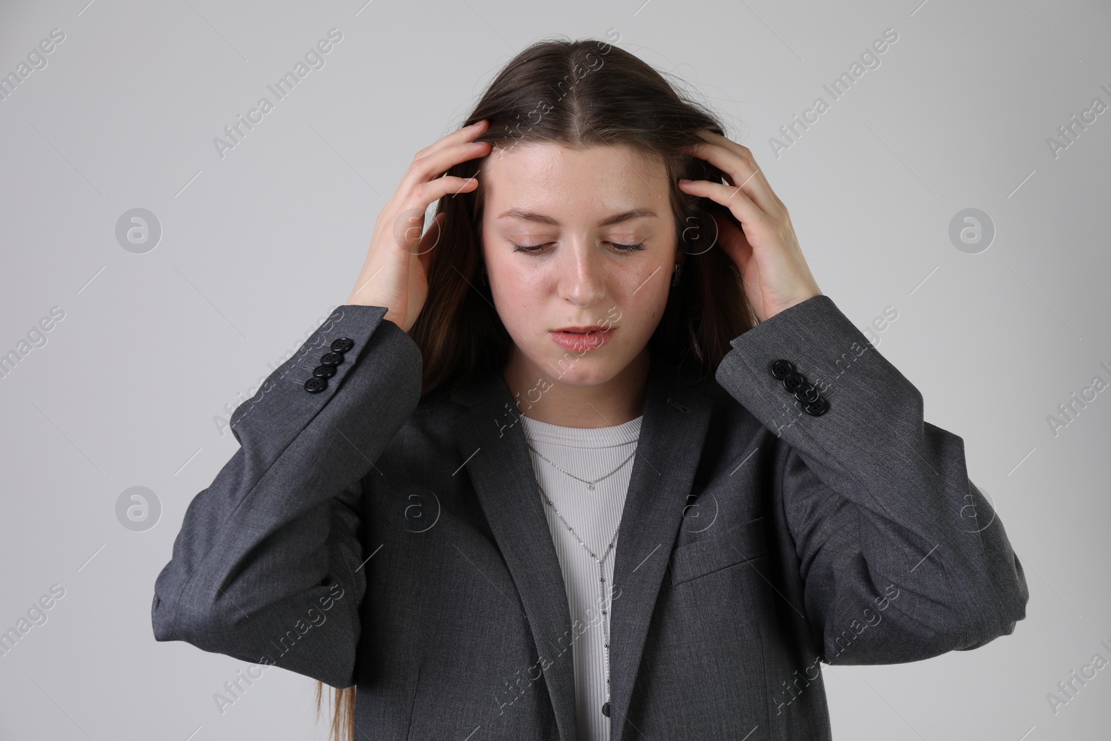 Photo of Portrait of beautiful young woman on light grey background