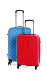 Modern suitcases for travelling on white background