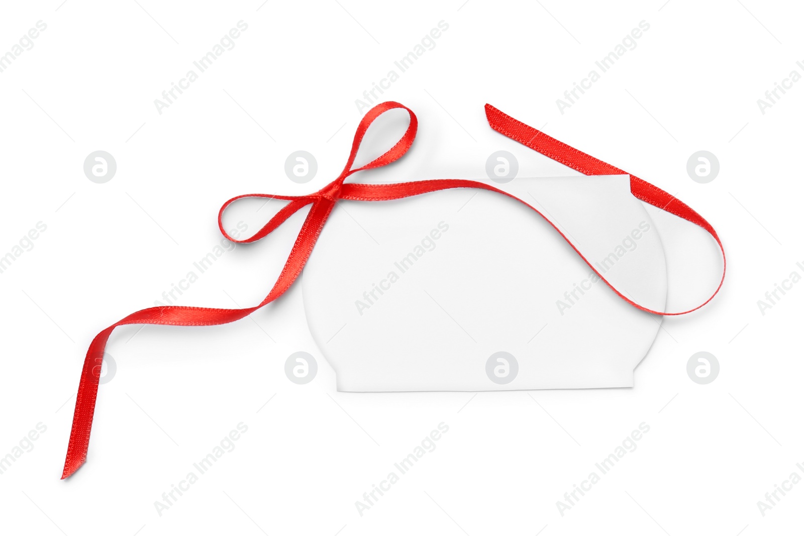 Photo of Blank gift tag with satin ribbon on white background, top view