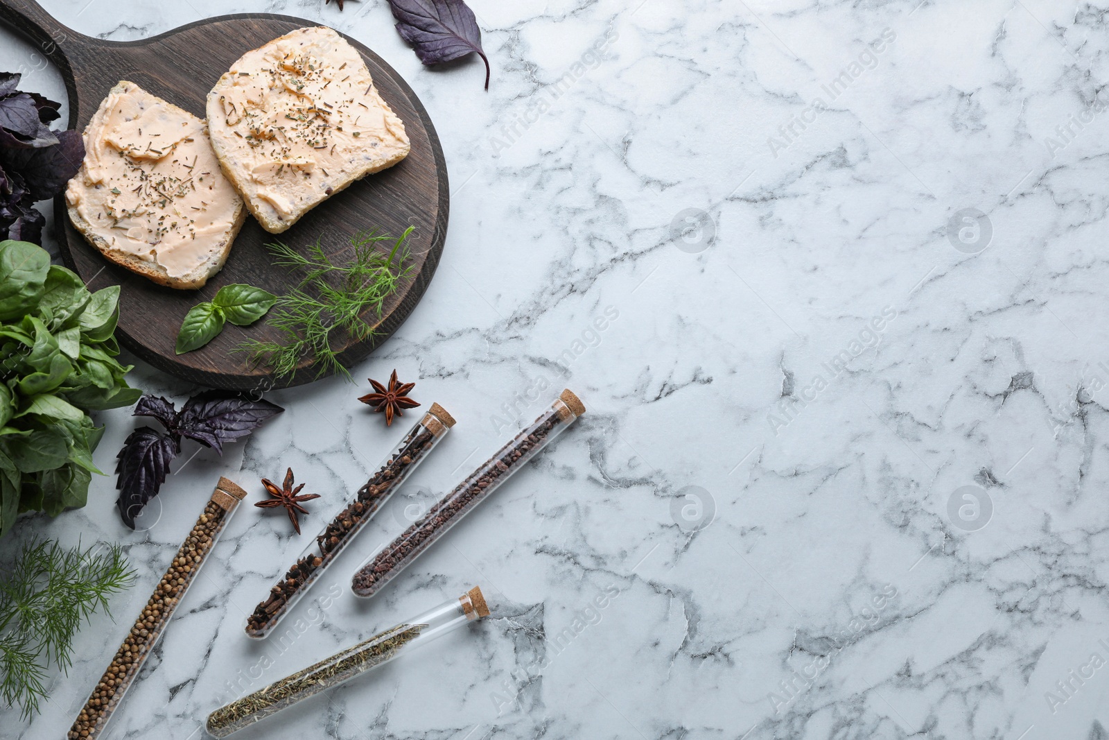 Photo of Flat lay composition with sandwiches, different spices and herbs on white marble table. Space for text