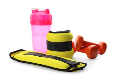 Photo of Stylish weighting agents, dumbbells and shaker on white background