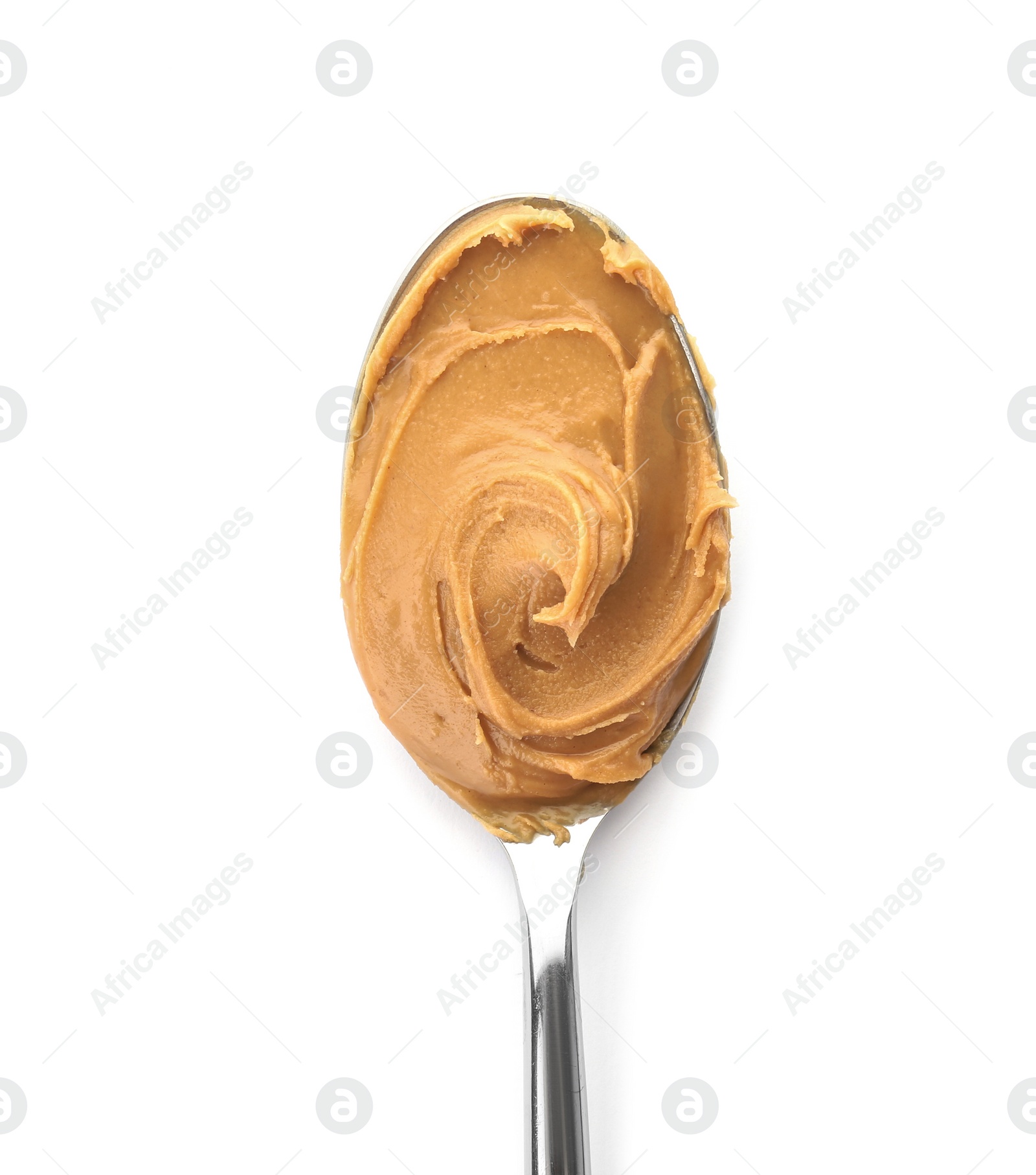 Photo of Creamy peanut butter in spoon on white background