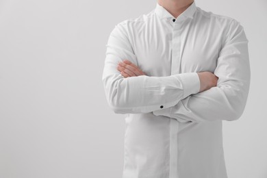 Photo of Man wearing classic shirt on white background, closeup