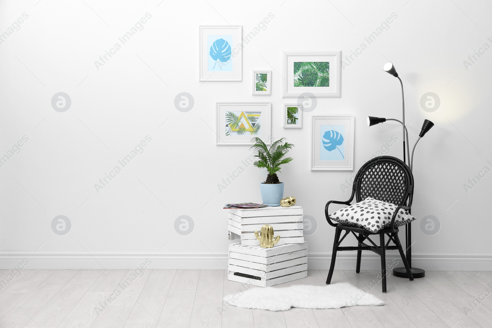 Photo of Stylish room interior with tropical leaves