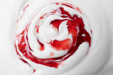 Photo of Tasty yogurt with jam as background, top view