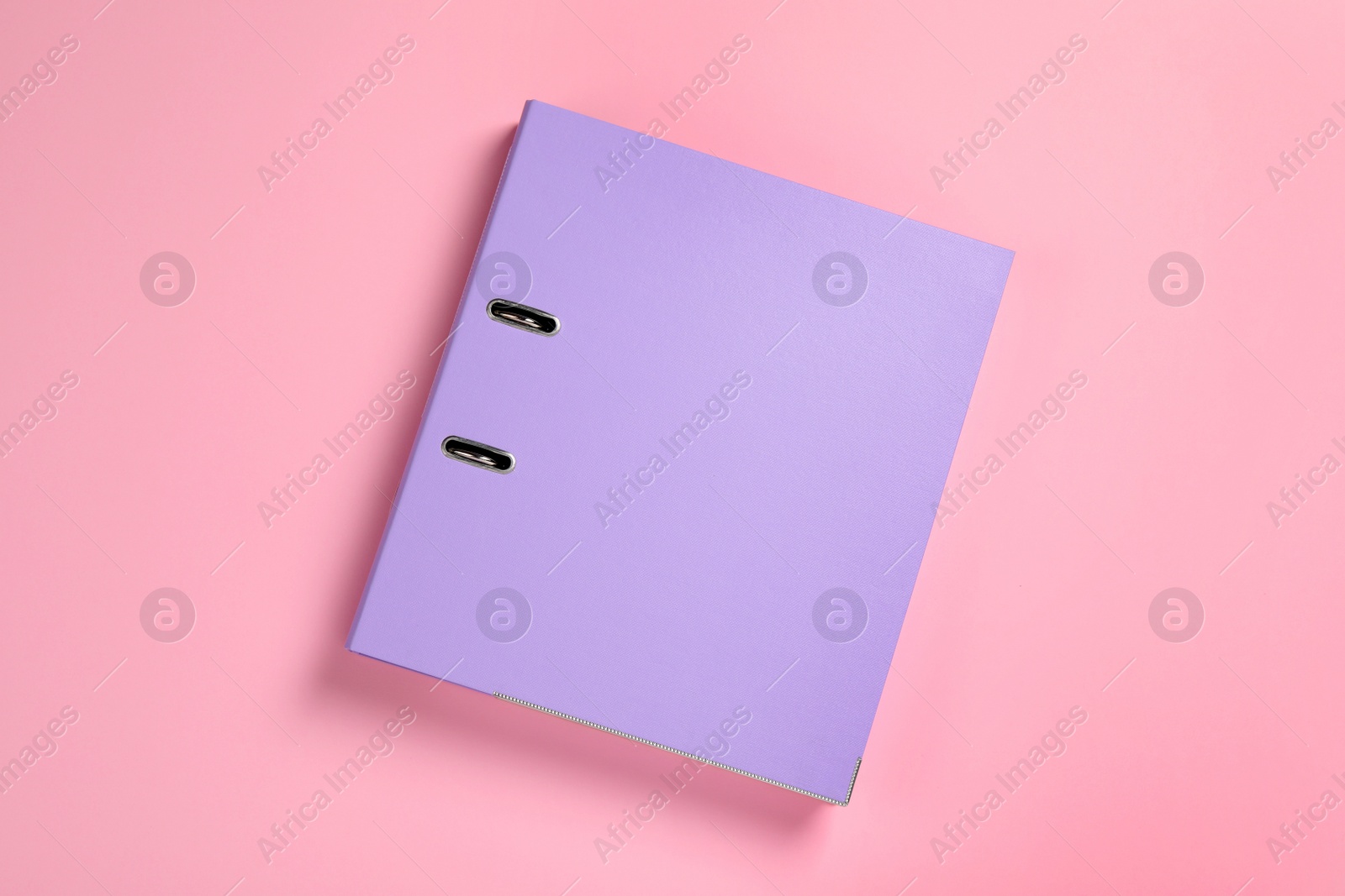 Photo of Lilac office folder on pink background, top view