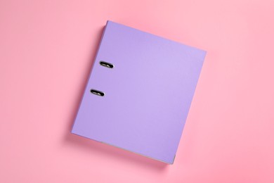 Photo of Lilac office folder on pink background, top view