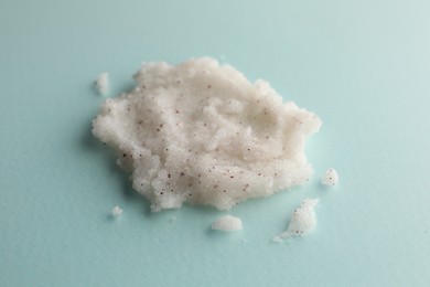 Photo of Sample of natural scrub on turquoise background