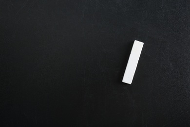 Piece of chalk on blackboard, top view