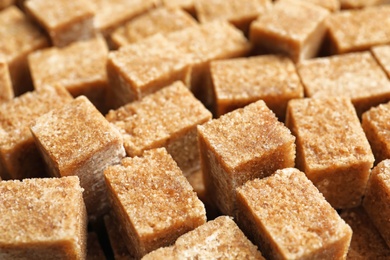 Photo of Cubes of brown sugar as background