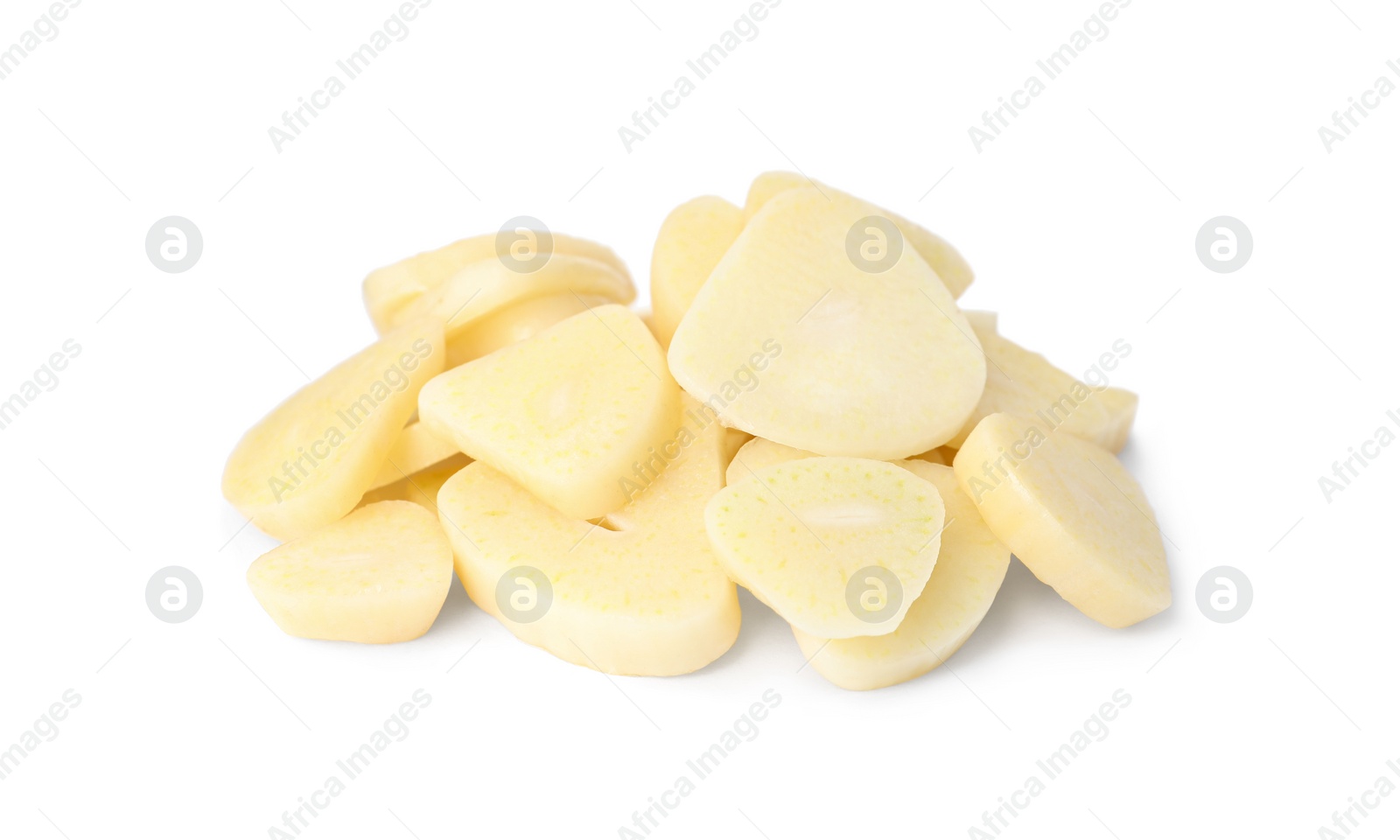 Photo of Pile of fresh sliced garlic cloves isolated on white. Organic food