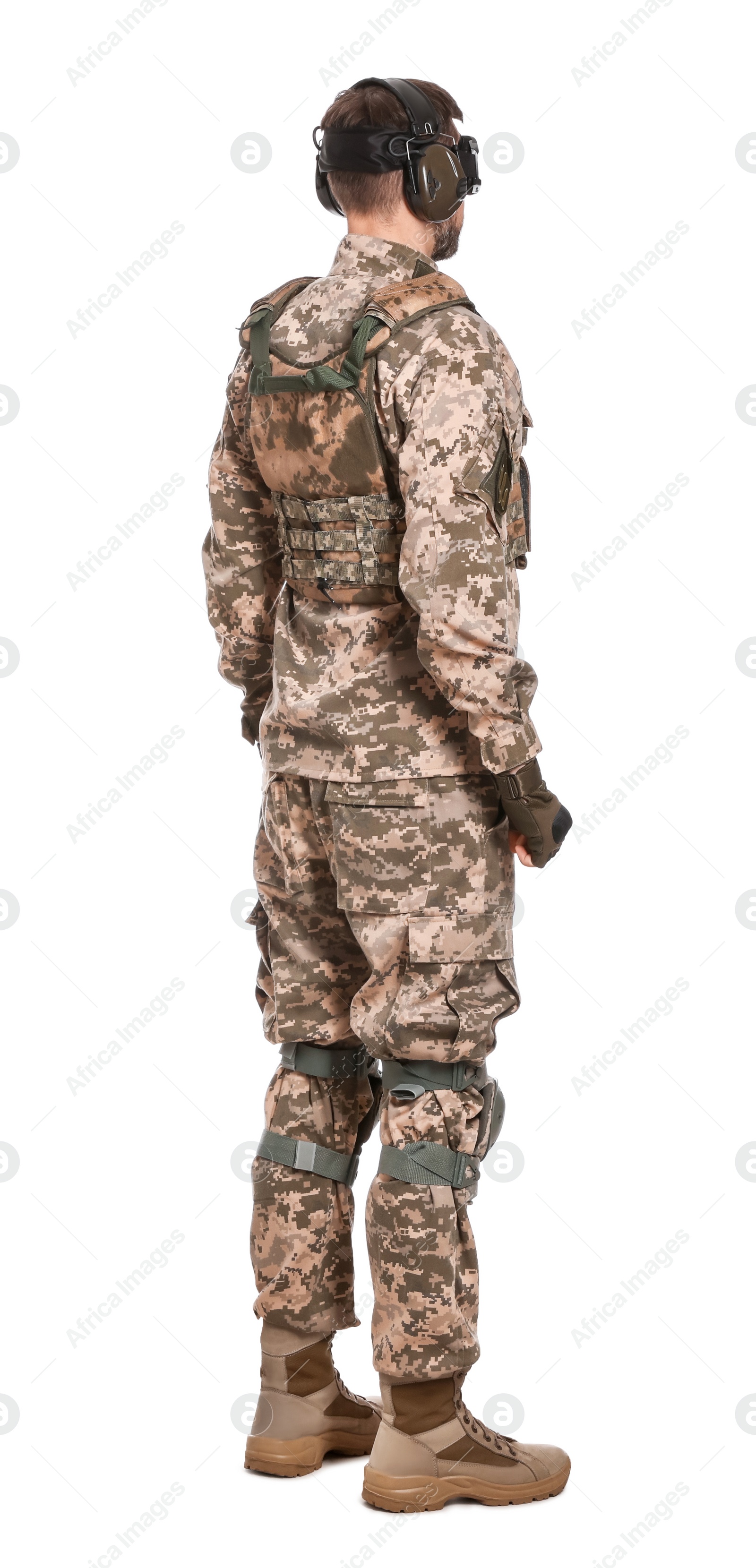 Photo of Soldier in Ukrainian military uniform and active tactical headphones on white background