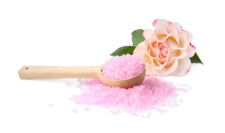 Wooden spoon with pink sea salt and beautiful flower on white background