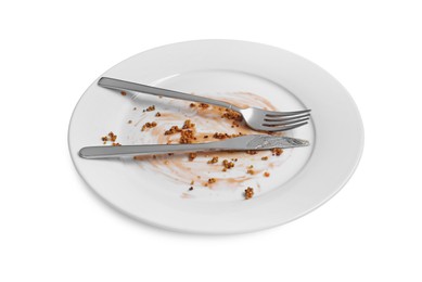 Dirty plate and cutlery on white background