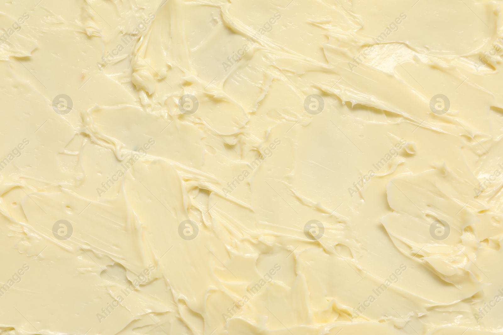 Photo of Texture of fresh natural butter as background, top view