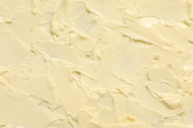 Photo of Texture of fresh natural butter as background, top view