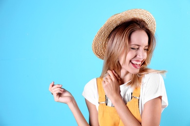 Photo of Portrait of beautiful laughing woman on color background