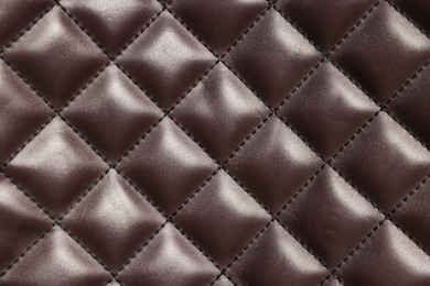 Photo of Brown natural leather with seams as background, top view