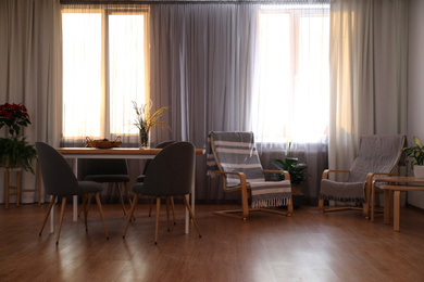 Photo of Windows with stylish curtains in living room interior