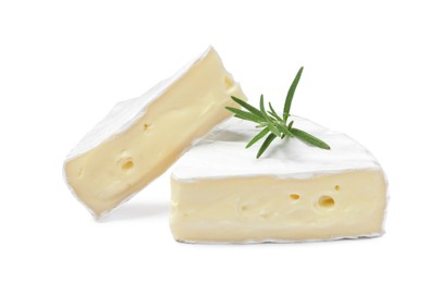 Tasty cut brie cheese with rosemary on white background
