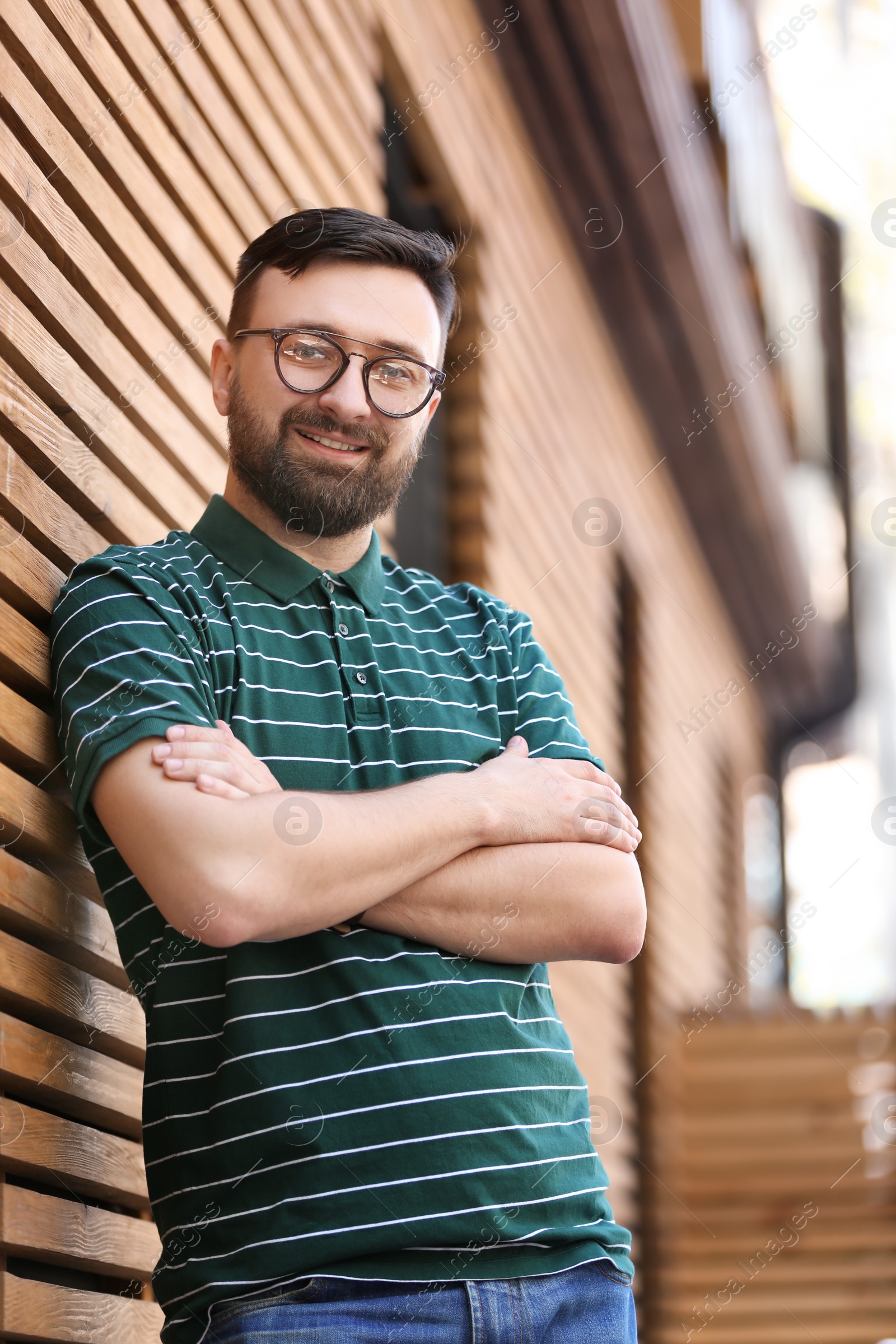 Photo of Portrait of young man in stylish outfit outdoors