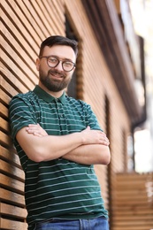 Portrait of young man in stylish outfit outdoors