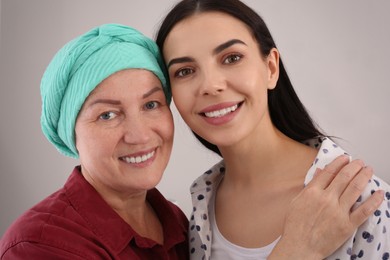 Photo of Young woman visiting her mother with cancer indoors