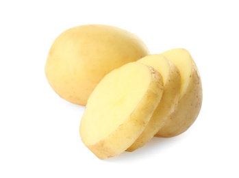 Photo of Whole and cut fresh raw organic potatoes on white background