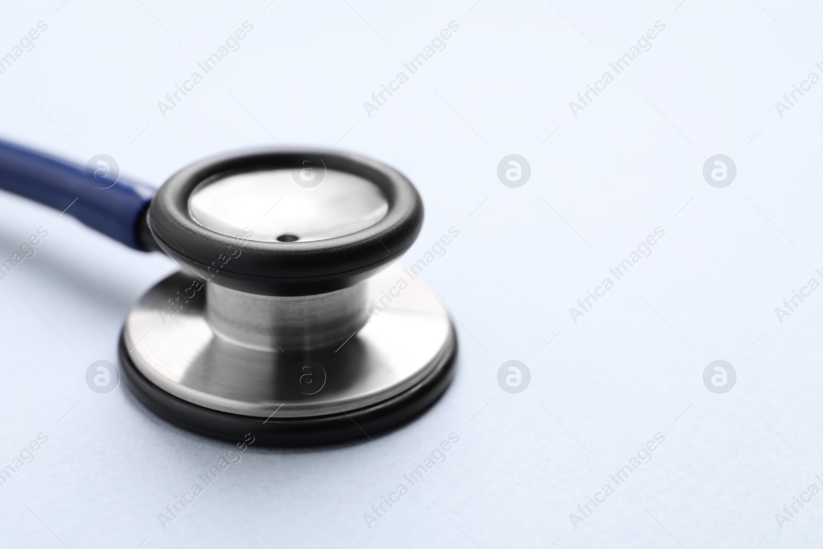 Photo of Stethoscope on white background, closeup. Space for text