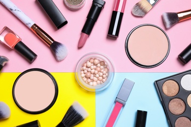Photo of Different luxury makeup products on color background, flat lay