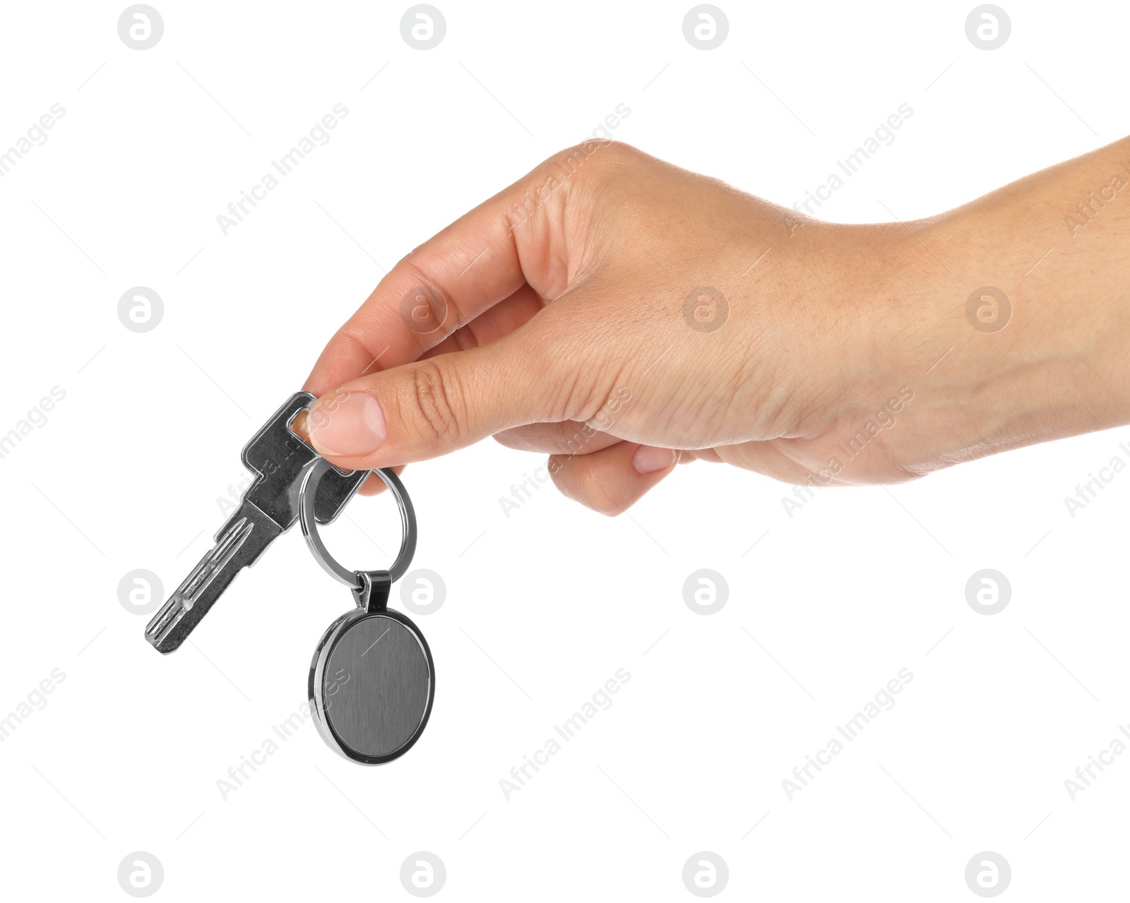 Photo of Woman holding key with metallic keychain on white background, closeup