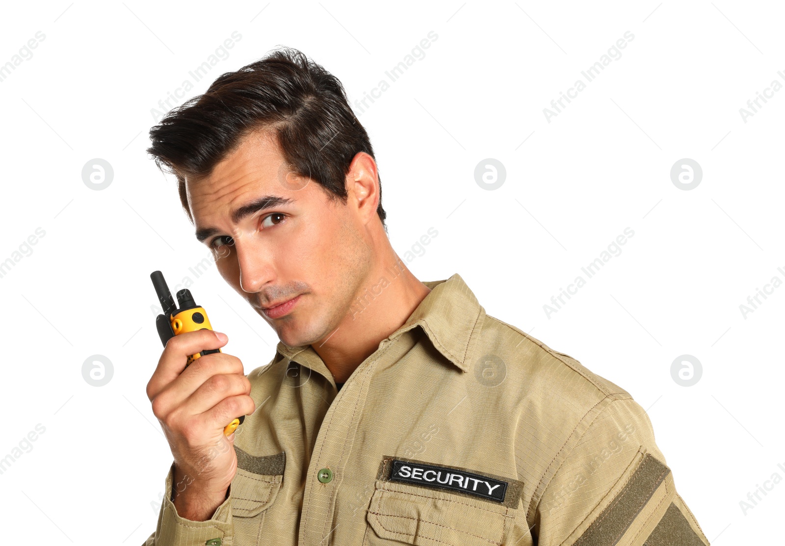 Photo of Male security guard in uniform using portable radio transmitter on white background