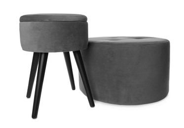 Photo of Stylish grey velvet stool and ottoman on white background